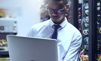 Male employee in server room