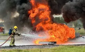 Defence - Firefighter extinguishing an industrial fire