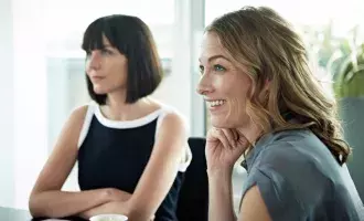 Smiling business women in meeting