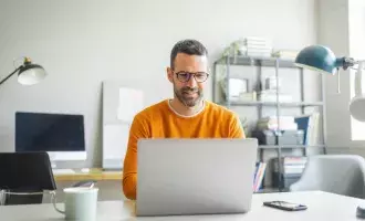 Man working on computer-2160502733 - Embed