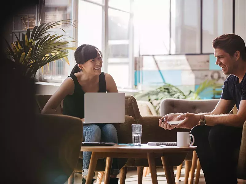 Workplace IT people remote working in a coffee shop