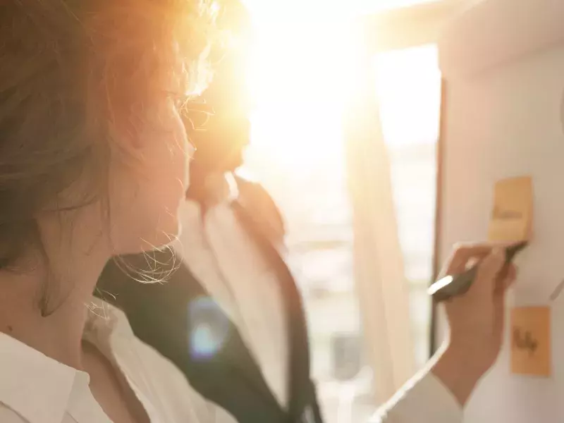 Capita apprenticeships People writing on post it notes